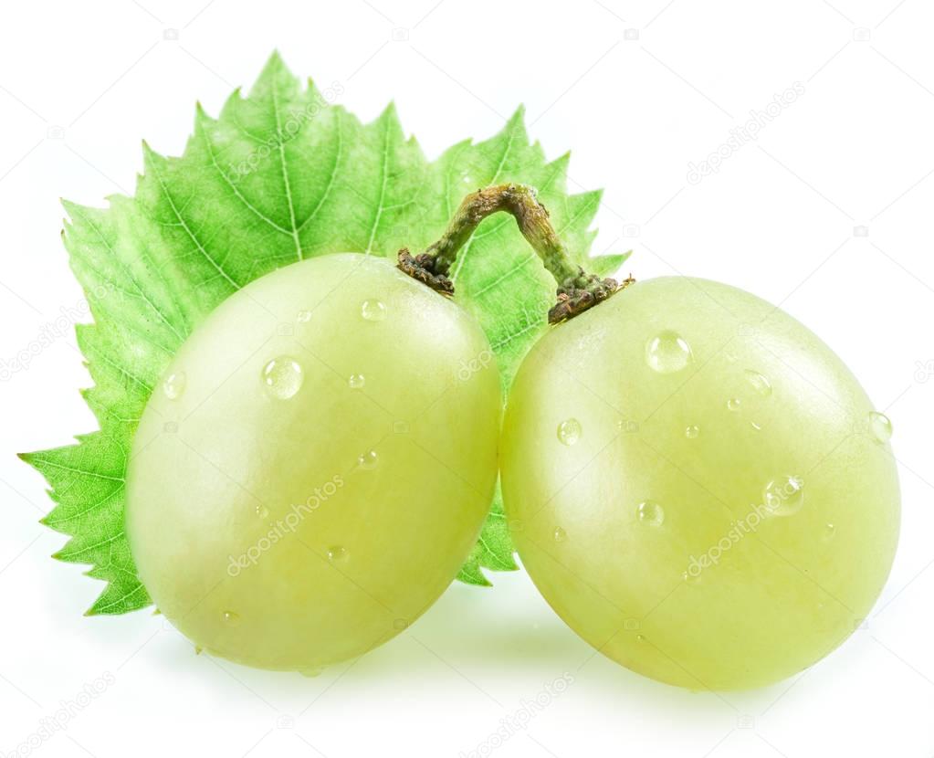 Two grapes with small leaf on the white background.