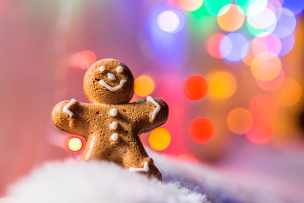 Gingerbread man in the snow. Christmas symbol.