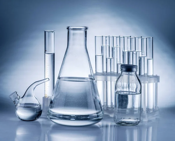 Different laboratory beakers and glassware. — Stock Photo, Image