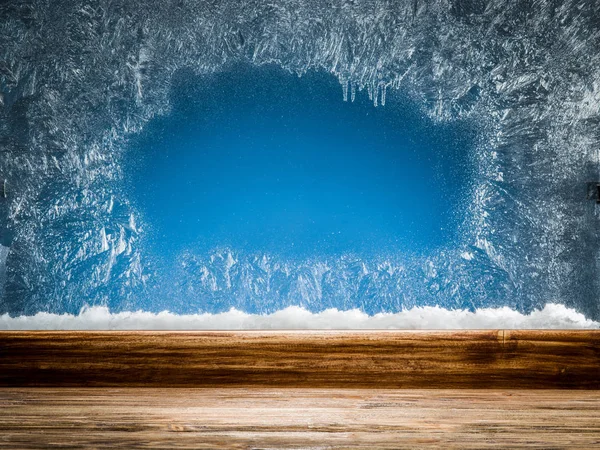 Wooden sill and frozen window. Christmas or New Year background. — Stock Photo, Image