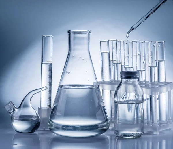 Different laboratory beakers and glassware. — Stock Photo, Image