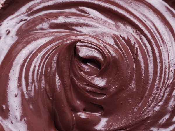 Geschmolzene Schokolade oder Schokoladenglasur. — Stockfoto