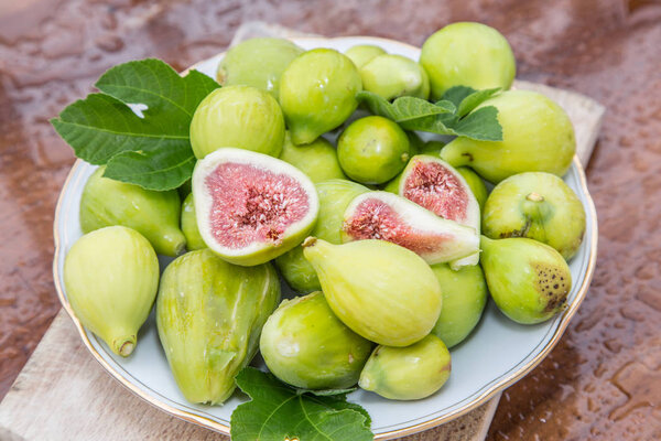 Ripe fig fruits on the wooden table.