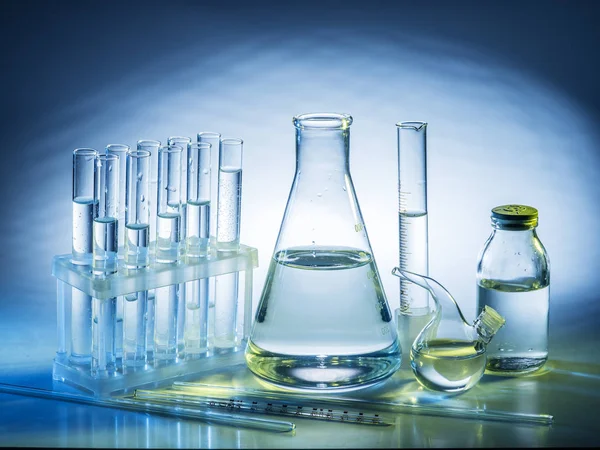 Different laboratory beakers and glassware. — Stock Photo, Image