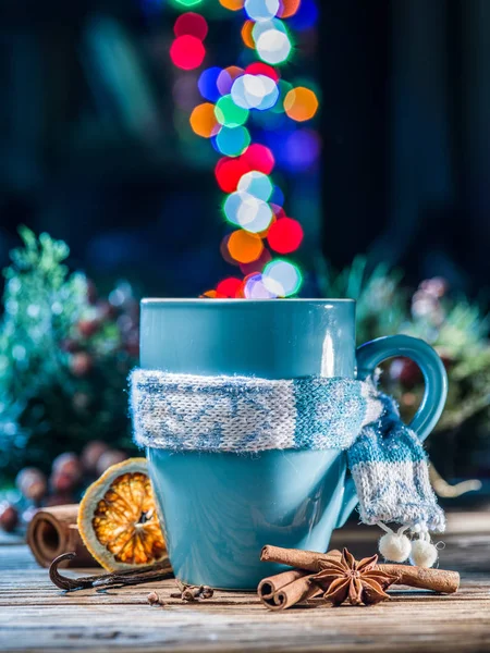 Cup with magic colorful lights and spices. Christmas background. — Stock Photo, Image