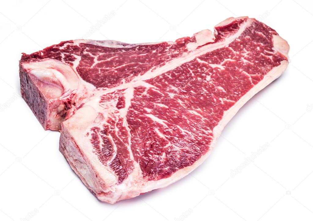 Raw T-bone steak on the white background.
