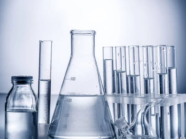 Different laboratory beakers and glassware. — Stock Photo, Image