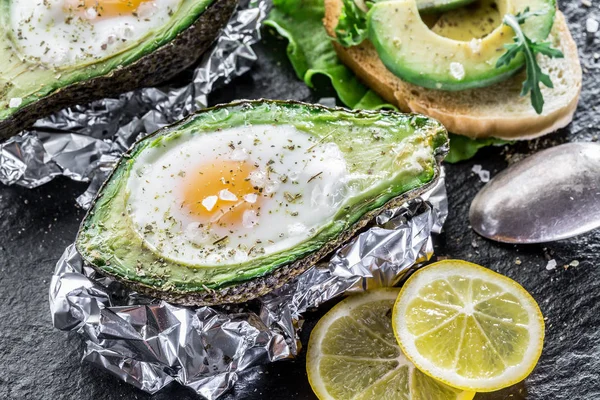 Chiken egg baked in avocado.