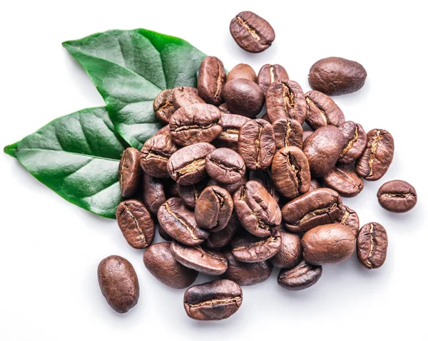 Roasted coffee beans and leaves on white background. — Stock Photo, Image