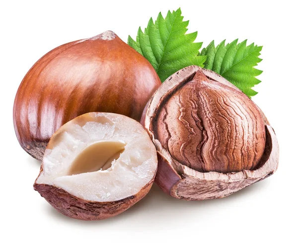 Hazelnuts, kernel of hazelnut and green leaves. Clipping path. — Stock Photo, Image