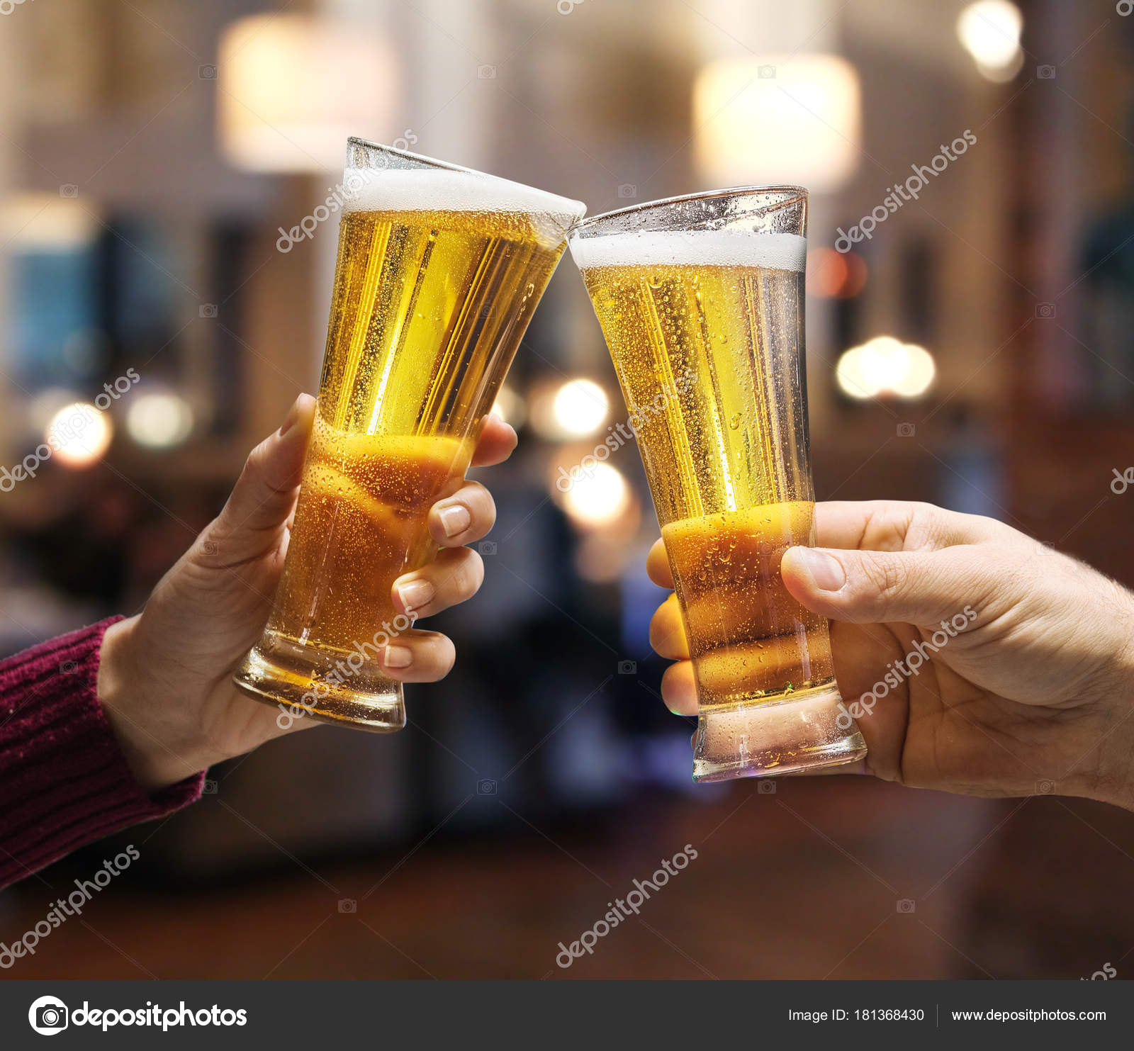 https://st3.depositphotos.com/1020804/18136/i/1600/depositphotos_181368430-stock-photo-beer-glasses-raised-in-a.jpg