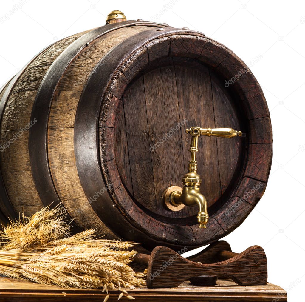 Beer barrel with bunch of wheat on the wooden table. Clipping pa