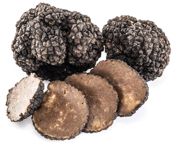 Trufas pretas isoladas em um fundo branco. — Fotografia de Stock