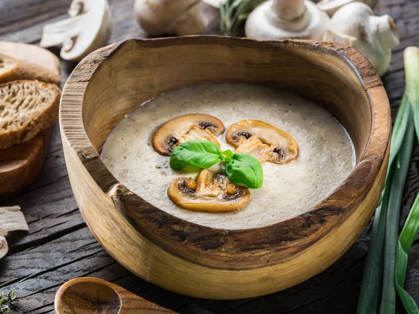 Cream soup with mushrooms on wooden table. Top view. — Stock Image Cream soup with mushrooms on wooden table. Top view. Royalty Free Stock Images
