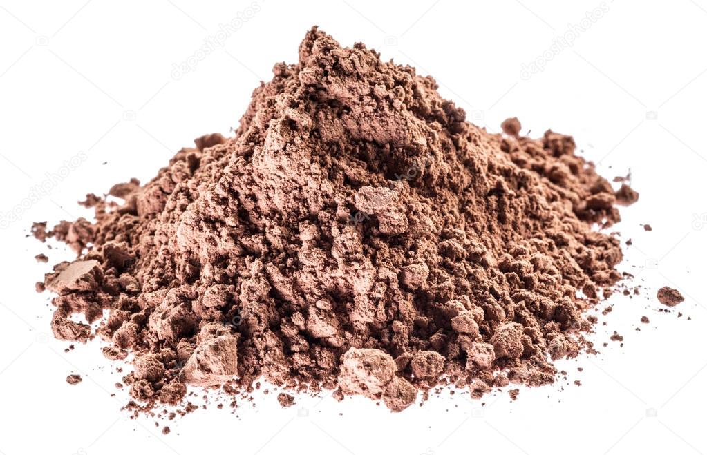 Cocoa powder or carob powder on white background.
