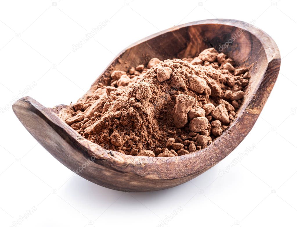 Cocoa powder or carob powder in wooden bowl on white background
