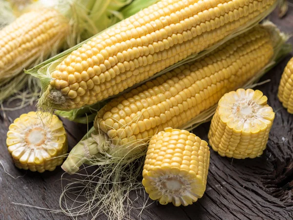 Ear of maize or corn on the dark wooden background. — Stock Photo, Image