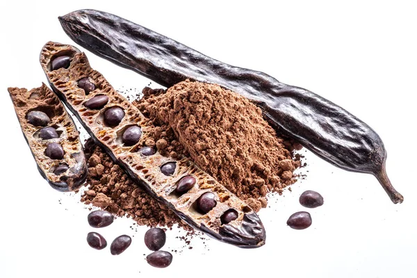 Carob pods and carob powder on the white background. — Stock Photo, Image