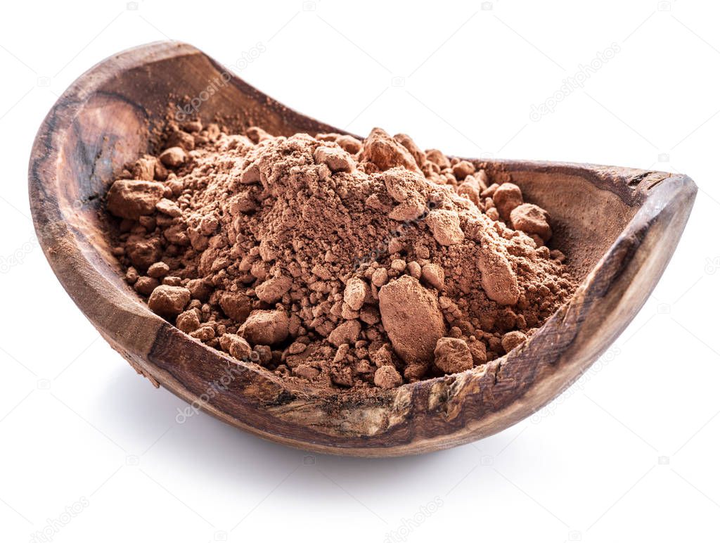 Cocoa powder or carob powder in wooden bowl on white background