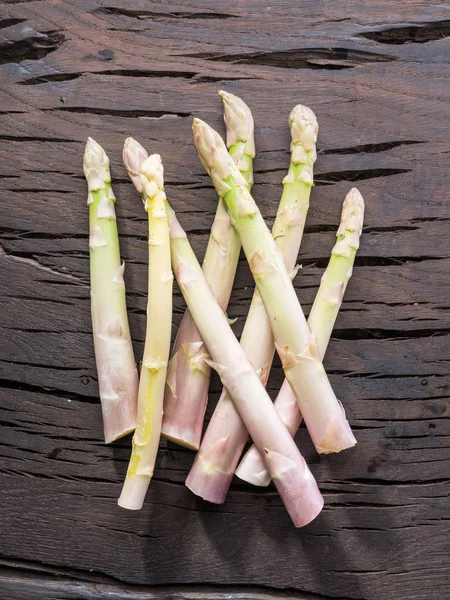 White fresh asparagus sprouts on wooden table. Royal vegetable. — Stock Photo, Image