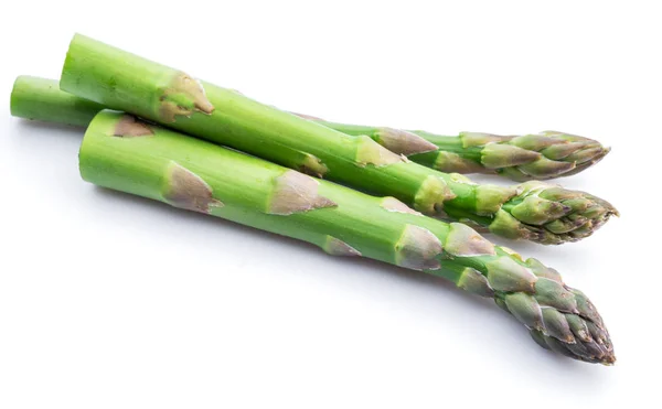 Three green fresh asparagus sprouts white background. — Stock Photo, Image