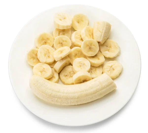 Banana descascada e fatias de banana no prato . — Fotografia de Stock