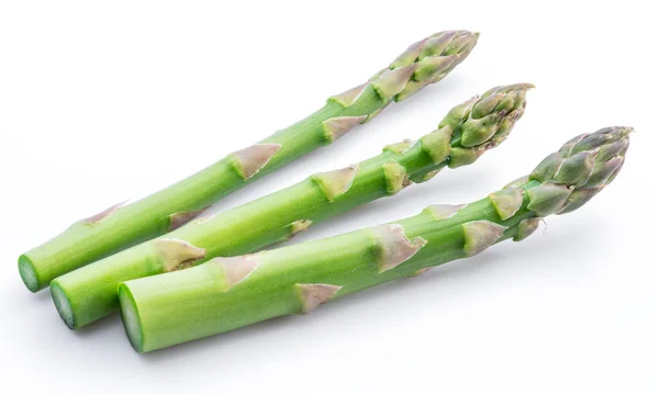 Three green fresh asparagus sprouts white background. — Stock Photo, Image