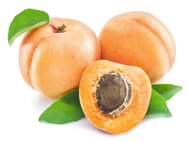 Apricot fruits and its cross-section on the white background. — Stock Photo, Image