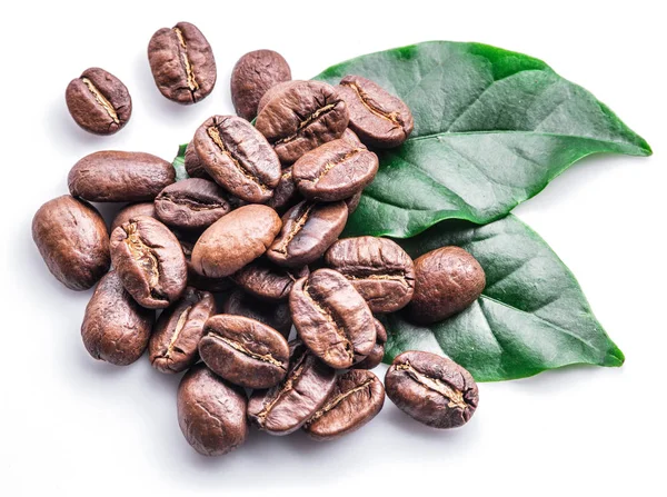 Roasted coffee beans and leaves on white background. — Stock Photo, Image