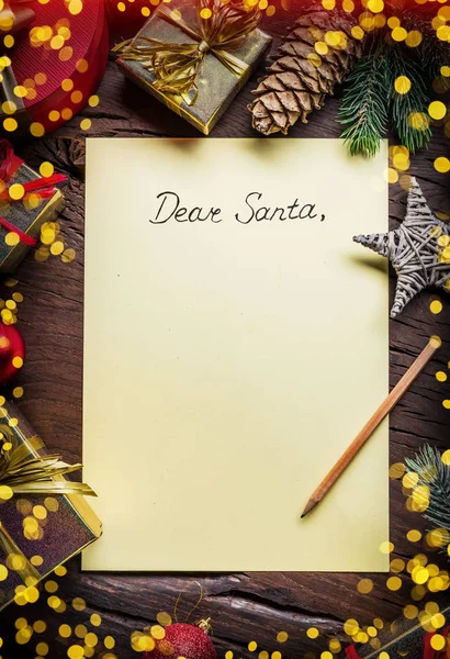 Empty Santa paper letter and Christmas decoration around it. Chr