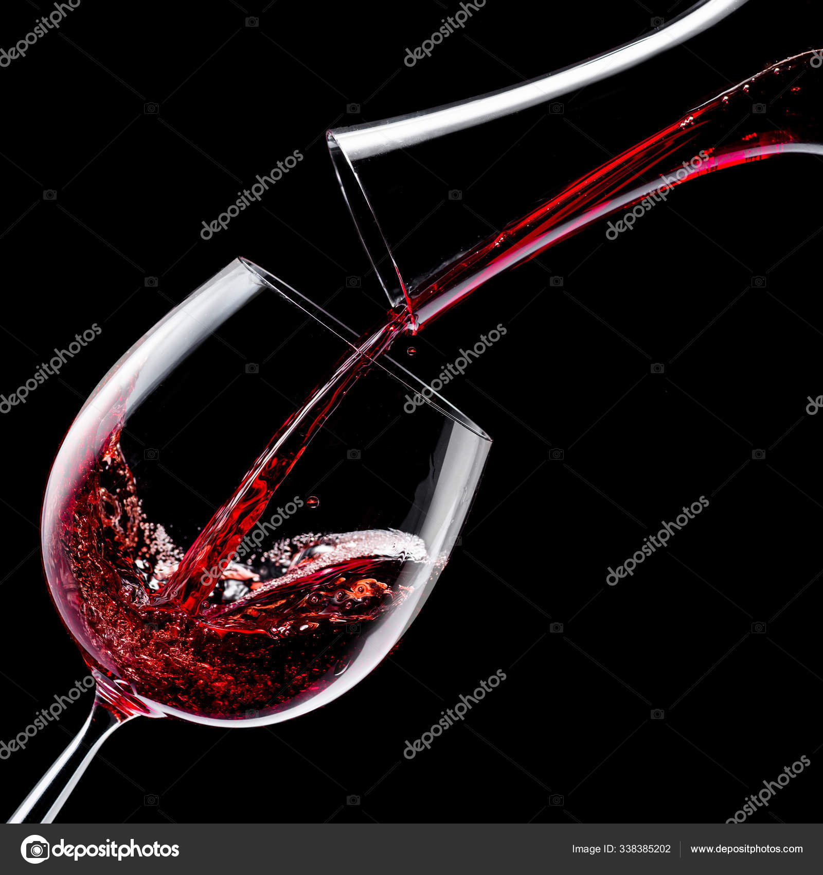 Red wine is poured into a wine glass on a black background. Stock Photo by  ©Valentyn_Volkov 338385202