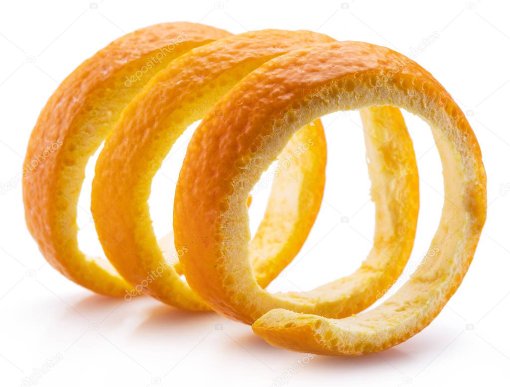 Orange peel or orange twist on white background. Close-up.