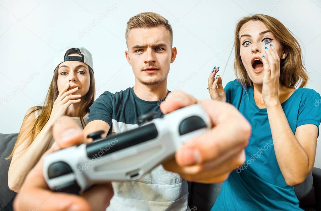 Teens Having Fun Playing Video Game
