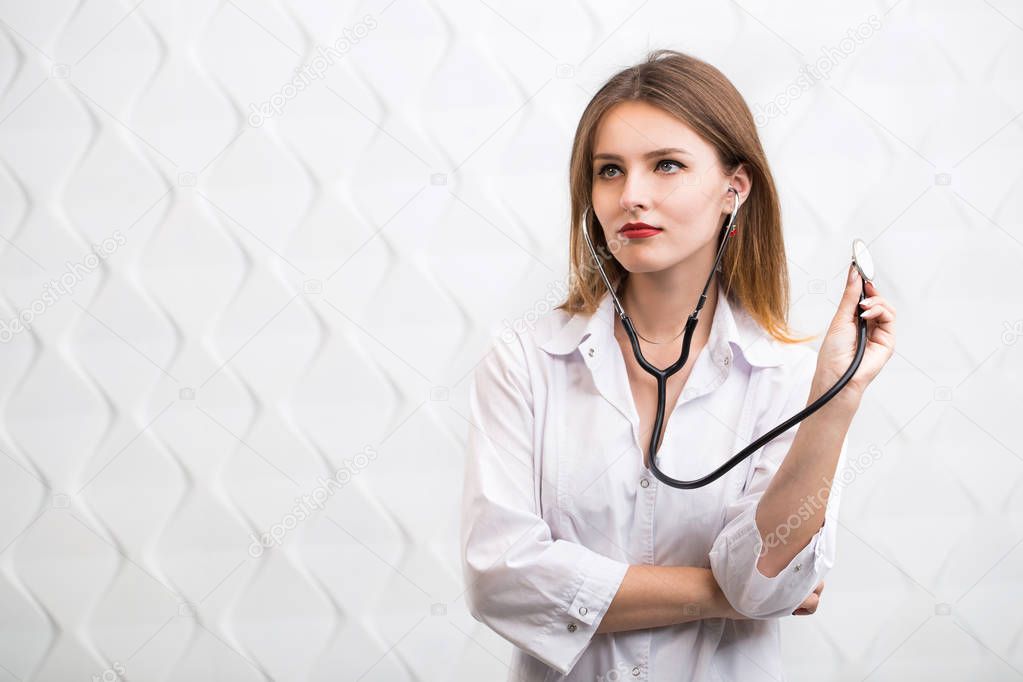 Female Doctor Uses Stethoscope