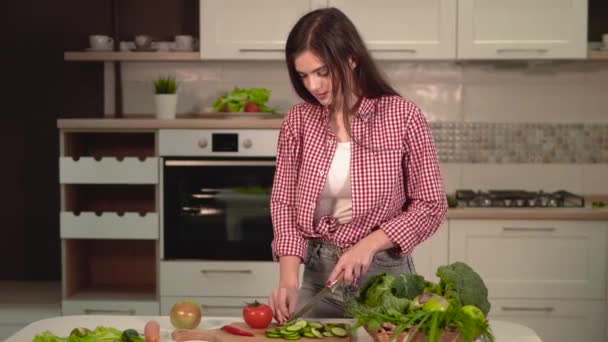 Woman Slices Cucumber — Stock Video