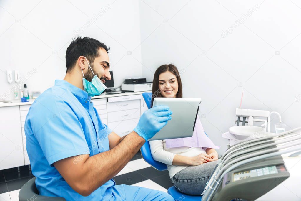Doctor Shows Teeth X-ray on Tablet