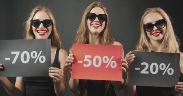 Woman Demonstrating Black Friday Posters — Stock Video
