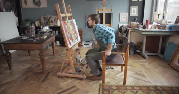 Male Artist Working in Studio — Stock Video
