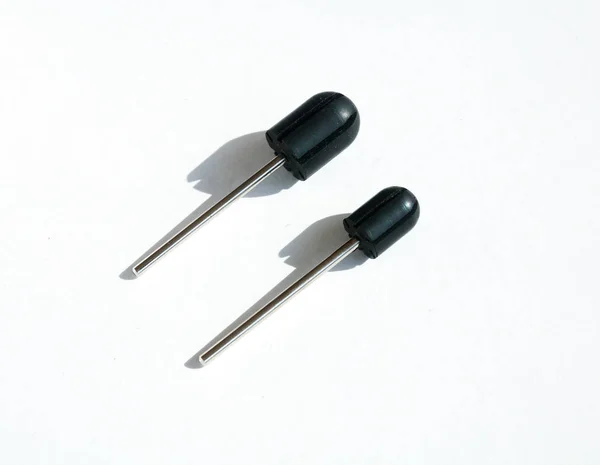 Two sanding cap rubber mandrels. White backgound. Drill bits, different sizes — Stock Photo, Image