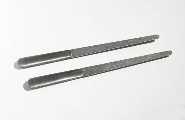 Two stainless steel nail file. White background