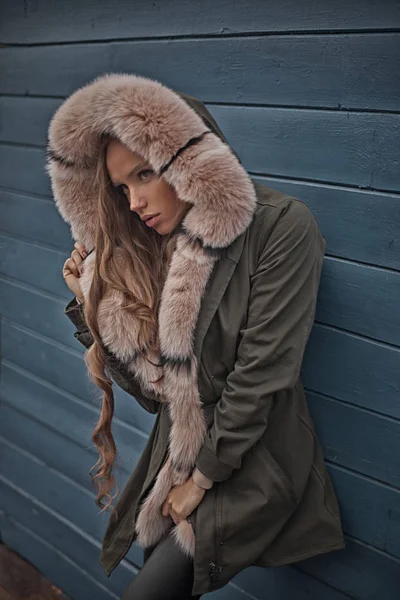 Portrait of beautiful and sexy woman in dark hood with fur — Stock Photo, Image