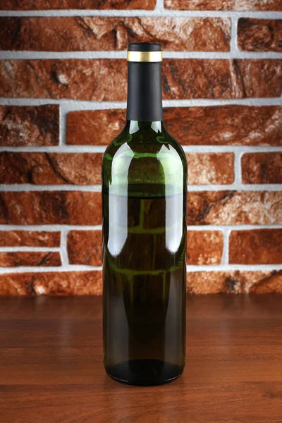 Glass bottle on table — Stock Photo, Image