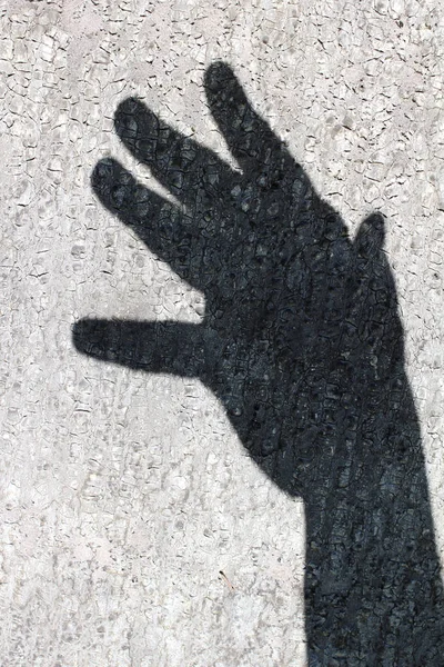 Dunkler Schatten Einer Männlichen Hand Auf Einer Betonwand — Stockfoto