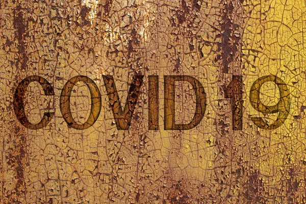 碑文錆びた金属製の壁にコヴィド コロナウイルスをテーマにした背景 — ストック写真