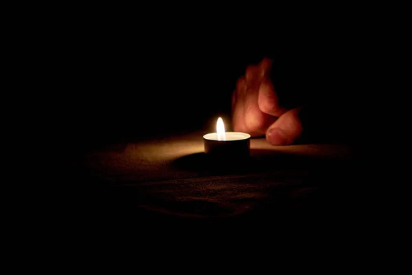 Human Fist Shown Next Burning Candle Dark Background — Stock Photo, Image