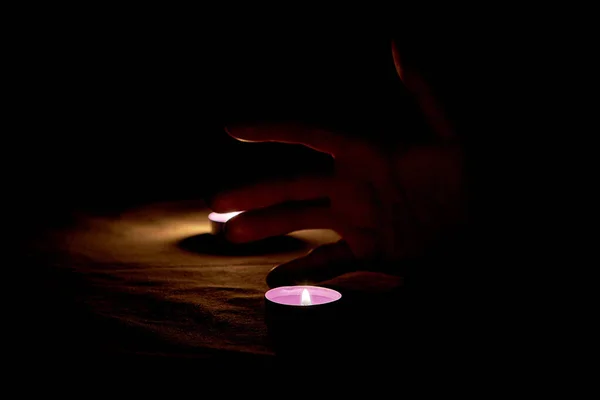 Man Hand Next Two Candles Burning Purple Dark — Stock Photo, Image