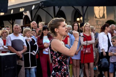 May 25, 2019 Minsk Belarus A theatrical performance in which a young woman with a microphone sings in front of a crowd of people
