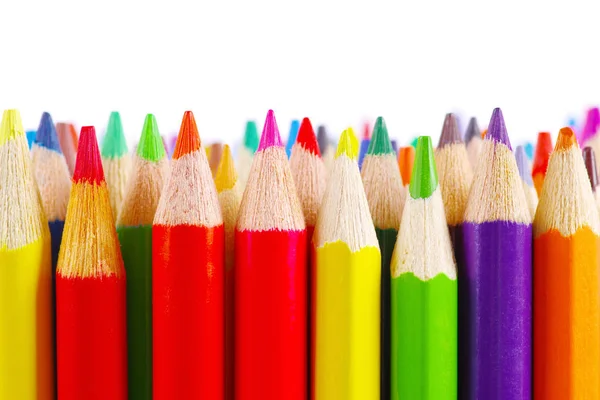 Stak af farvede blyanter på hvid baggrund - Stock-foto