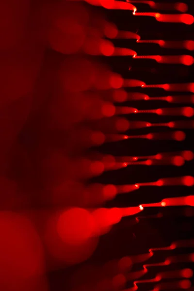 Bakgrund av röd Led lampor med bokeh effekt — Stockfoto