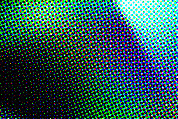 Colorful soft circular bokeh overlay for use to enhance images with copy space on a deep twilight blue background